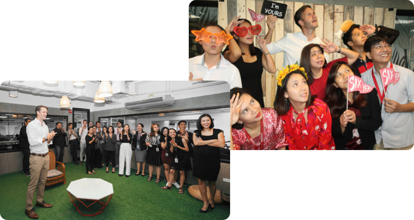 Employees in Group Photo Wearing Photobooth Props