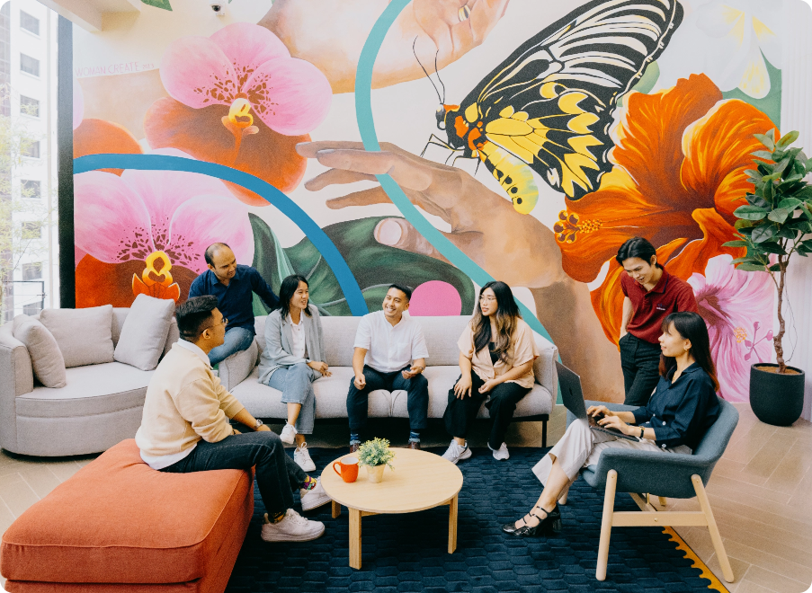 Business Meeting in Front of Floral-Painted Wall with 7 People