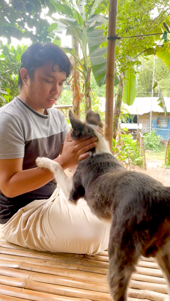 John playing with his dog